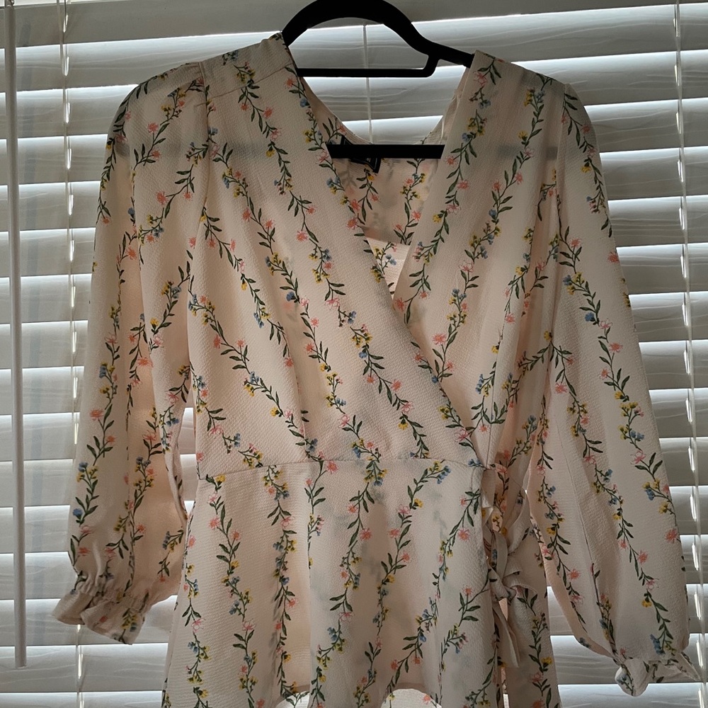 Blush floral wrap blouse